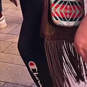 Shyanne fringe purse hooked leather detailing